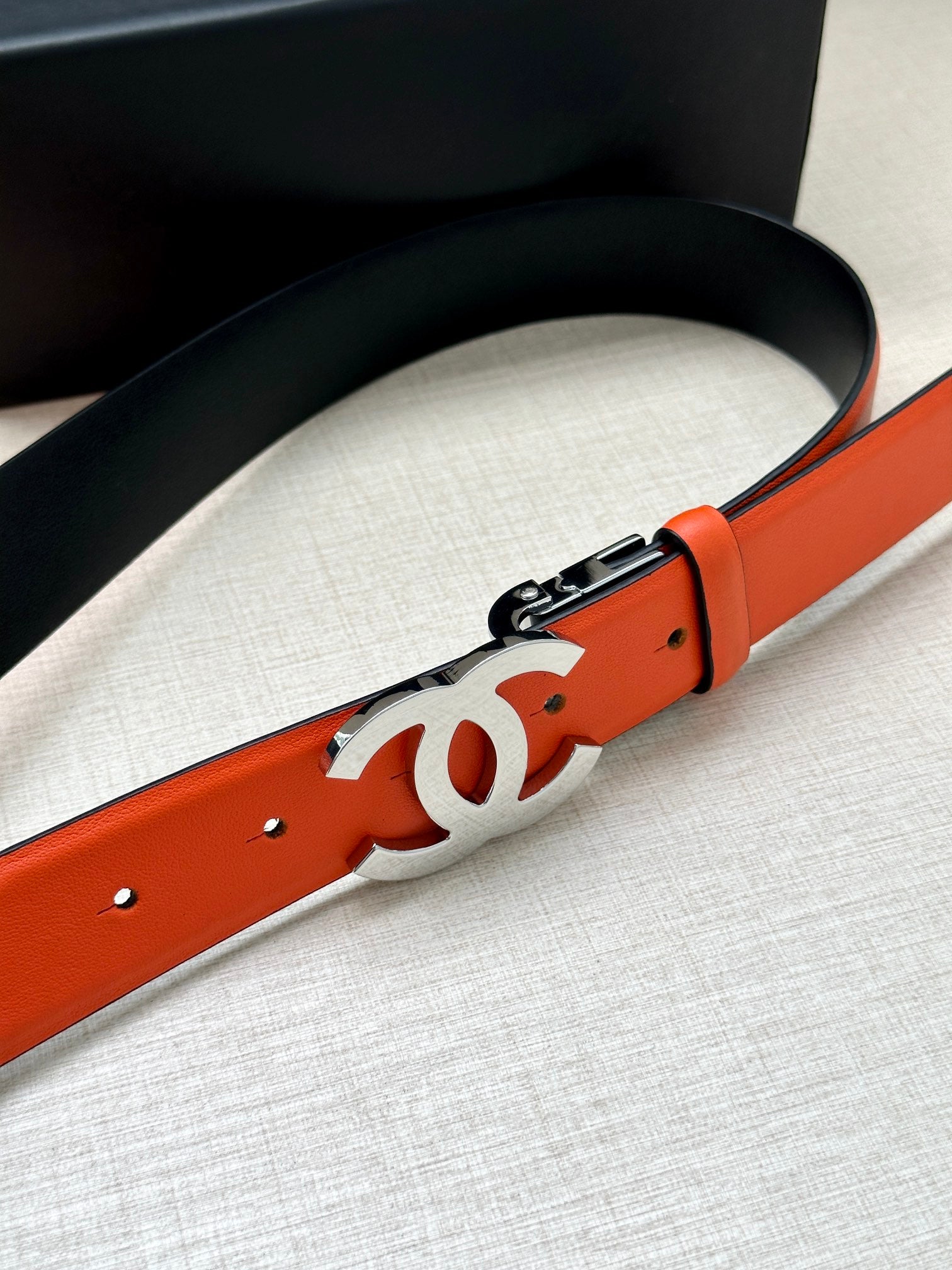 CHANEL 30MM BELT IN FIRE ORANGE AND BLACK CALFSKIN WITH SILVER HARDWARE