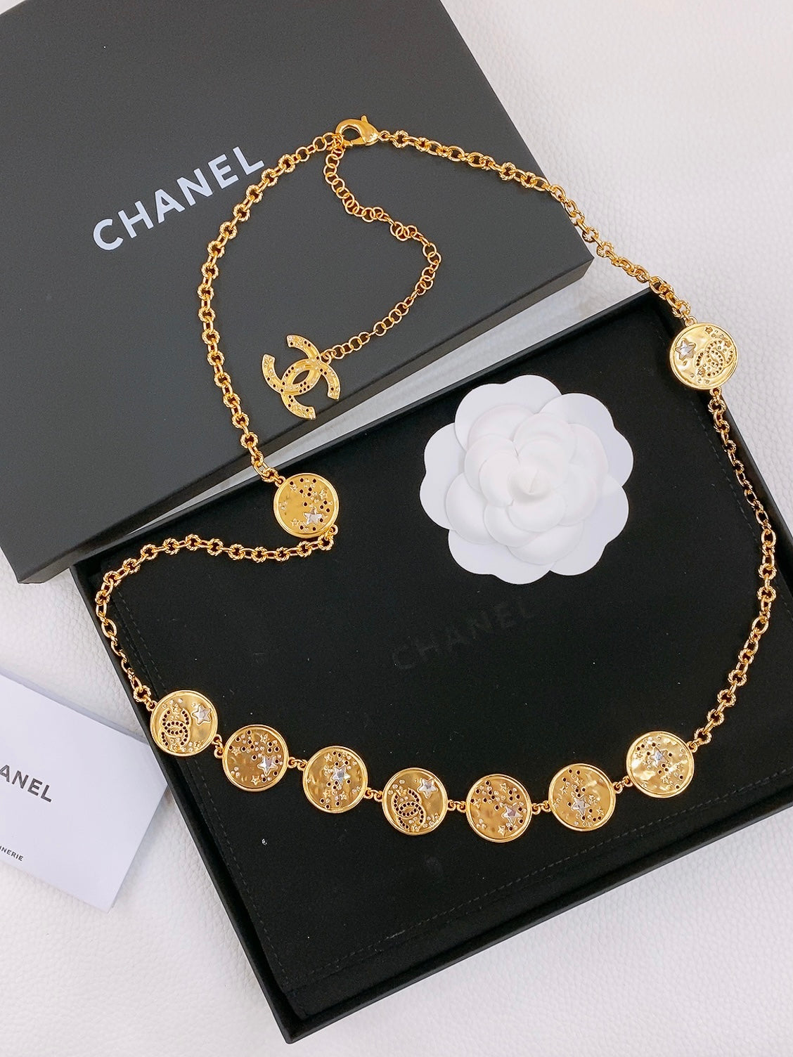 CHANEL TWISTED CHAIN BELT WITH RHINESTONES AND LOGO PLATE IN GOLD TONE