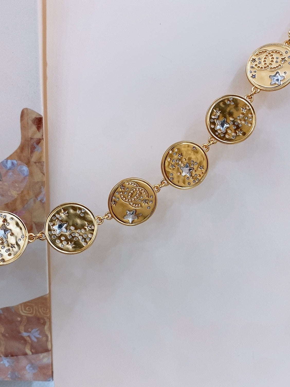 CHANEL TWISTED CHAIN BELT WITH RHINESTONES AND LOGO PLATE IN GOLD TONE