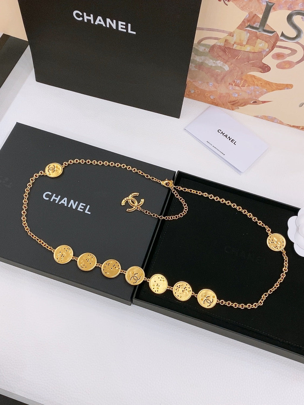 CHANEL TWISTED CHAIN BELT WITH RHINESTONES AND LOGO PLATE IN GOLD TONE