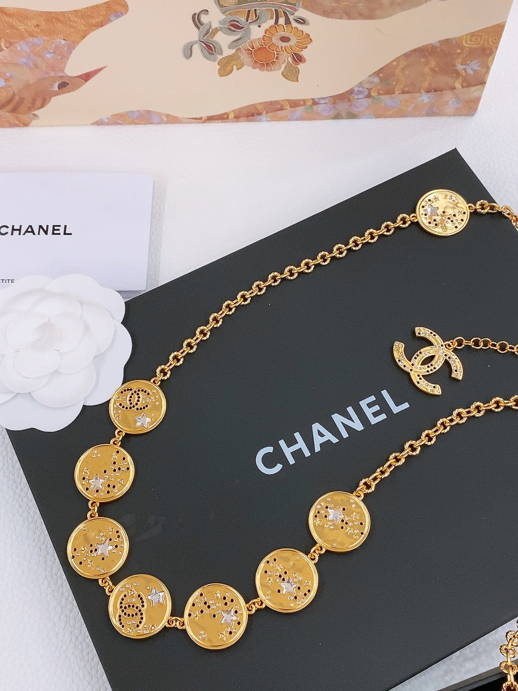 CHANEL TWISTED CHAIN BELT WITH RHINESTONES AND LOGO PLATE IN GOLD TONE